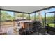 Covered and screened-in patio with hot tub and exterior access to backyard at 813 Lancer Cir, Ocoee, FL 34761