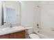 Bathroom featuring a shower-tub combo, vanity with sink, and a toilet at 9492 Flowering Cottonwood Rd # 82, Orlando, FL 32832