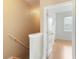 Upstairs hallway with wood-look flooring and access to bedrooms and bathrooms at 9492 Flowering Cottonwood Rd # 82, Orlando, FL 32832