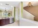 Open kitchen featuring a stylish light fixture, stainless steel dishwasher, and views of the living area at 9492 Flowering Cottonwood Rd # 82, Orlando, FL 32832