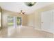 Open living room featuring tile flooring and sliding glass doors to a private patio at 9492 Flowering Cottonwood Rd # 82, Orlando, FL 32832