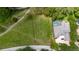 High aerial view of a homesite surrounded by lush greenery and mature trees in a golf community at 9517 San Fernando Ct, Howey In The Hills, FL 34737