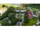 Aerial view of the golf clubhouse with extensive parking and well-manicured landscaping at 9517 San Fernando Ct, Howey In The Hills, FL 34737
