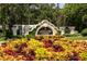 Sign marking the entrance to Mission Inn Resort, surrounded by colorful foliage and manicured landscaping at 9517 San Fernando Ct, Howey In The Hills, FL 34737