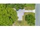 Overhead view of the home showcasing the roof, yard, and mature trees providing shade and privacy at 102 Mayrose Dr, Sanford, FL 32771