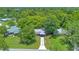 A beautiful aerial view shows the property's location, landscaping, and neighborhood setting at 102 Mayrose Dr, Sanford, FL 32771