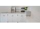 A remodeled kitchen with gray cabinets, granite countertops, stainless appliances, and tile flooring at 102 Mayrose Dr, Sanford, FL 32771