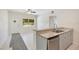 Bright kitchen features granite countertops, stainless steel appliances, and a breakfast bar at 102 Mayrose Dr, Sanford, FL 32771