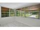 Bright sunroom with tile floors and lots of natural light from the multiple windows at 102 Mayrose Dr, Sanford, FL 32771