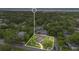 Spacious home nestled among lush trees near the water with a large front yard and a long driveway at 1210 S Palmetto Ave, Sanford, FL 32771