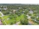 Aerial view of a neighborhood showcasing a community park and tree-lined streets, enhancing the suburban charm at 1210 S Palmetto Ave, Sanford, FL 32771