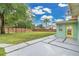 Large fenced backyard with a modern patio and a vibrant green lawn at 1210 S Palmetto Ave, Sanford, FL 32771