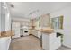 Bright kitchen featuring white appliances, ample counter space, and natural light at 1210 S Palmetto Ave, Sanford, FL 32771