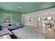 Spacious living room with a view to the dining room, featuring stylish furniture at 1210 S Palmetto Ave, Sanford, FL 32771
