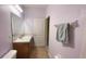 Bathroom with vanity, mirror, toilet, and a towel rack with a towel for convenience at 12630 Old Plantation Ln, Orlando, FL 32824