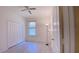 Bright bedroom features a ceiling fan, a window providing natural light, and a spacious closet with white doors at 12630 Old Plantation Ln, Orlando, FL 32824