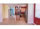 Bright kitchen with tile flooring, stainless steel appliances, and a center island at 12630 Old Plantation Ln, Orlando, FL 32824