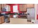 Modern kitchen with granite countertops, stainless steel appliances, and wood cabinets at 12630 Old Plantation Ln, Orlando, FL 32824