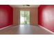 Open living area featuring sleek flooring and sliding glass doors for natural light at 12630 Old Plantation Ln, Orlando, FL 32824