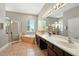 Bright bathroom with a soaking tub, walk-in shower, double vanity, and tile flooring at 13943 Caywood Pond Dr, Windermere, FL 34786