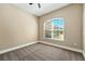 Cozy bedroom with neutral carpet, natural light from a window, and freshly painted walls at 13943 Caywood Pond Dr, Windermere, FL 34786