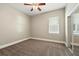 Cozy bedroom with plush carpeting and natural light, with closet with mirrored doors for ample storage at 13943 Caywood Pond Dr, Windermere, FL 34786