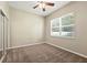 Bright bedroom features neutral walls, carpet, a ceiling fan, and natural light from a window at 13943 Caywood Pond Dr, Windermere, FL 34786