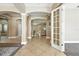 Open foyer with arched doorways, neutral paint, tile floors and views of adjacent living spaces at 13943 Caywood Pond Dr, Windermere, FL 34786
