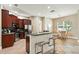 Well-equipped kitchen area featuring a breakfast bar and a seamless connection to the dining area at 13943 Caywood Pond Dr, Windermere, FL 34786
