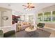 Open-concept living room with neutral tones, contemporary furnishings, and abundant natural light at 13943 Caywood Pond Dr, Windermere, FL 34786