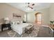 Serene main bedroom with a plush bed, soft lighting, and an ensuite bathroom at 13943 Caywood Pond Dr, Windermere, FL 34786