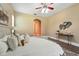 Comfortable main bedroom featuring a queen-sized bed and simple decorations at 13943 Caywood Pond Dr, Windermere, FL 34786