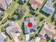 Aerial shot shows the property's location within a well-maintained neighborhood with manicured lawns and mature landscaping at 1425 Hollyberry Pl, The Villages, FL 32162