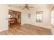Open concept living room featuring luxury laminate flooring and plenty of natural light at 1425 Hollyberry Pl, The Villages, FL 32162