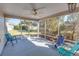 Relaxing screened porch with comfortable seating, ideal for enjoying the outdoors while protected from the elements at 1425 Hollyberry Pl, The Villages, FL 32162