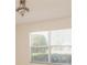 Bright room featuring natural light streaming through a large window at 1425 Hollyberry Pl, The Villages, FL 32162