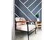 Stylish bedroom seating area with geometric wall design at 15071 Guava Bay Dr, Winter Garden, FL 34787
