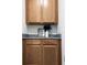 Wooden cabinetry with granite countertops provides an elegant storage solution in the home at 15071 Guava Bay Dr, Winter Garden, FL 34787