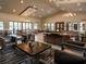 Spacious community clubhouse with modern decor, comfortable seating, and natural light at 15071 Guava Bay Dr, Winter Garden, FL 34787