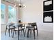 Bright dining room featuring a modern chandelier, large windows, and contemporary art, perfect for Gathering meals at 15071 Guava Bay Dr, Winter Garden, FL 34787