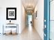 Inviting entryway featuring neutral walls, tile flooring, and stylish decor, leading into a bright, spacious home at 15071 Guava Bay Dr, Winter Garden, FL 34787