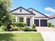 Charming one-story home with a well-maintained lawn and a two-car garage, perfect for modern living at 15071 Guava Bay Dr, Winter Garden, FL 34787