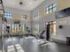 Well-equipped fitness center with natural light and modern machines for a complete workout experience at 15071 Guava Bay Dr, Winter Garden, FL 34787