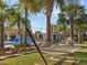 Relaxing hammock area is shaded by palm trees and offers a private poolside retreat at 15071 Guava Bay Dr, Winter Garden, FL 34787
