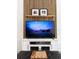 Cozy living room showcases a decorative slat wall, floating shelf and modern entertainment center at 15071 Guava Bay Dr, Winter Garden, FL 34787