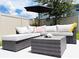 Stylish outdoor patio with comfortable wicker seating and a modern coffee table, perfect for entertaining at 15071 Guava Bay Dr, Winter Garden, FL 34787