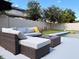 Inviting patio area with a plush outdoor sectional, coffee table, and pool view, ideal for relaxing outdoors at 15071 Guava Bay Dr, Winter Garden, FL 34787