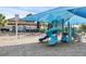 Community playground features slides, swings, and a covered seating area for sunny fun at 15071 Guava Bay Dr, Winter Garden, FL 34787