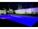 Sparkling pool with vibrant LED lighting and comfortable poolside seating for relaxing evenings by the water at 15071 Guava Bay Dr, Winter Garden, FL 34787