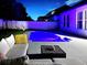 Relaxing outdoor patio with a pool, comfortable seating, and ambient lighting for evening enjoyment at 15071 Guava Bay Dr, Winter Garden, FL 34787
